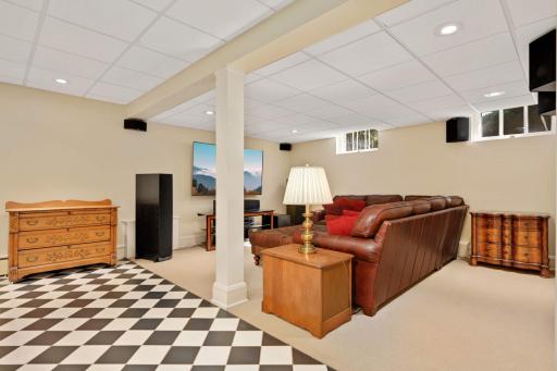 Nicely finished lower level offers a wonderful amusement/theater room and natural light from above-ground windows,