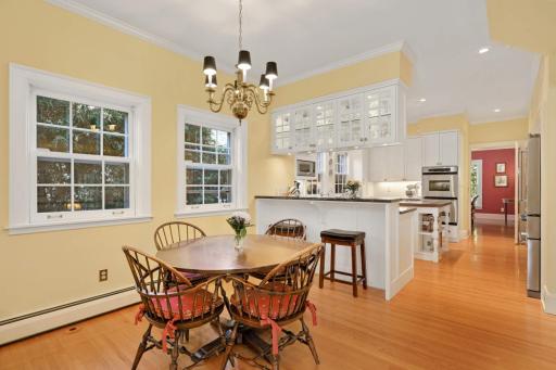 A spacious family dining area is adjacent to the breakfast bar