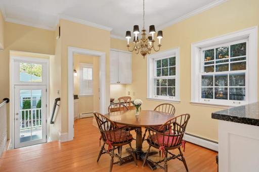 A planning desk to pay bills or do homework, a powder room, and a back hall with a closet and door leading to the back patio and yard.