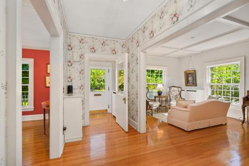 Large open foyer with oak flooring and high ceilings
