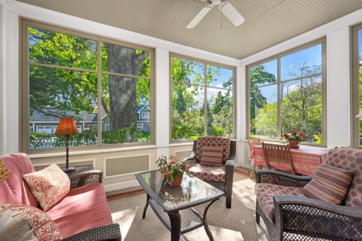 A large, peaceful screen porch that overlooks the sweeping backyard and features 9â 8â ceilings and a lovely beadboard wainscoting ceiling.