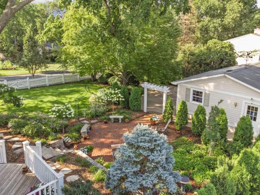 Spectacular large manicured backyard and a herringbone red-brick patio