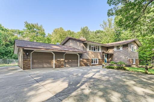 17715 University Ave NE, Ham Lake - 3 Bedrooms, 2 Baths, 4+ car garages. Enjoy the heavily wood 4.5 acres with plenty of space to roam. 2 Car attached garage and an extra deep 2+ detached garage. Quick closing and 1 Year HSA home warranty included