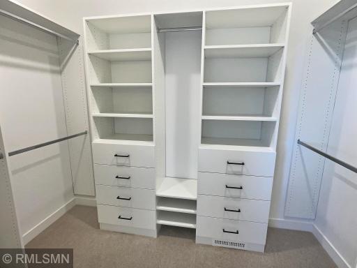 The primary suite features a walk-in closet with custom space. You will be able to stay refreshingly organized with this space.
