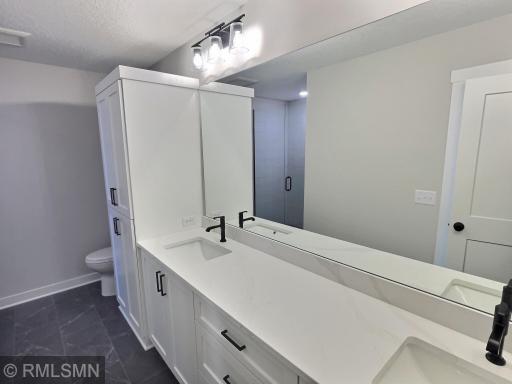 The tile accents are just wonderful, you will truly be pleased with the lower level three-quarter bathroom.