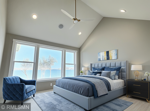VIRTUALLY ENHANCED PHOTO - Turn-in for the night in this primary suite, large windows showcase the breathtaking views of Lake John.