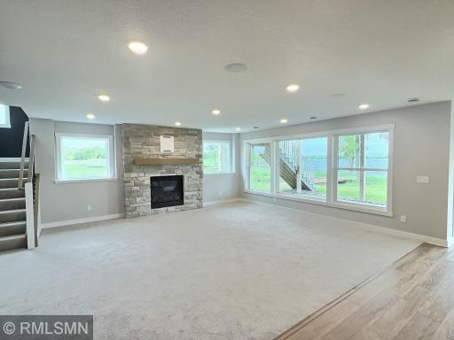 Another view of the lower level family room with gas fireplace, this will be such a wonderful gathering space.