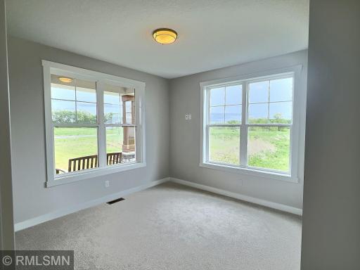 Turn-in for the night in the second bedroom on the main level with double large windows offering wonderful natural light.