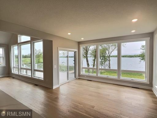 The dining room has a sliding glass door that leads to the 12x20 lakeside deck, you'll love summers on the shores of Lake John!