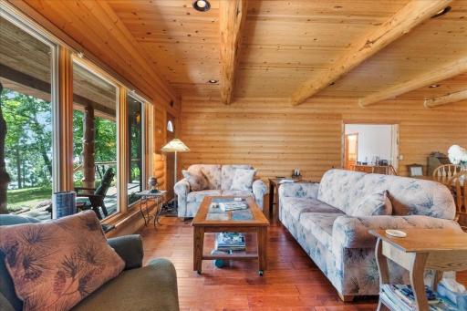 Living room opens to expansive lakeside deck