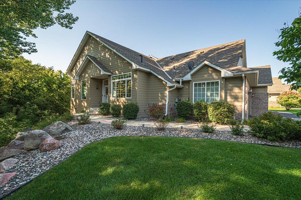 Beautifully landscaped w/ boulder walls & perennial gardens.