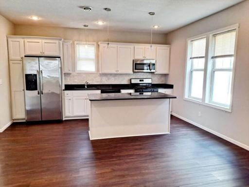 Unit 1 open concept main level with fabulous kitchen space!