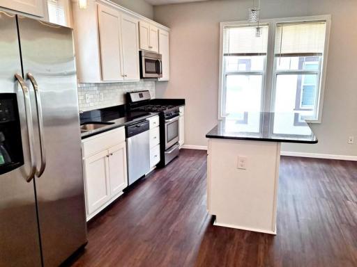 Stainless appliances, granite and beautiful floors