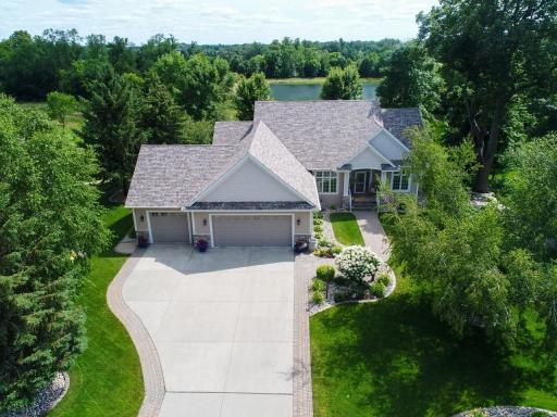 Attractive landscaping and mature trees provide both beauty and privacy.