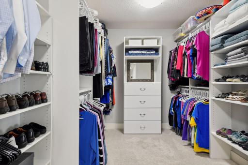 The bathroom leads to a generous walk-in closet.