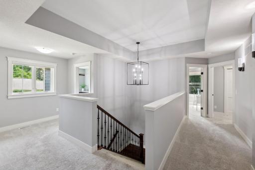 Upstairs, a versatile landing area can serve as a sitting room or homework spot.