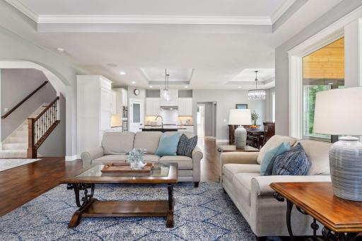 The great room connects to a gorgeous kitchen with stainless steel appliances, marble center island, convenient pantry.