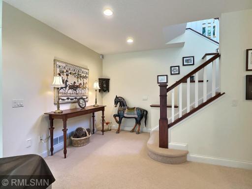 Spacious as you come down the steps to the lower level. Wide stairway, with beautiful woodwork throughout the home.