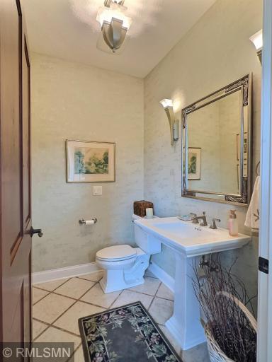 Main floor half bath, with custom decor and beautiful detail.