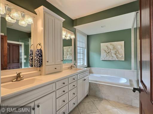 Relax in this soaking tub, and keep things organized with many drawers and double sinks. Speakers in bathroom as well.