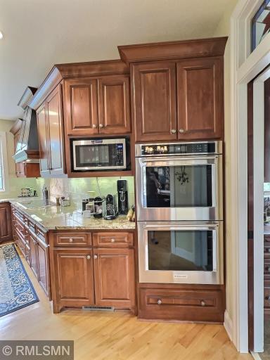 Built in double wall ovens that were new in 2023, custom cabinets, and granite countertops. All drawers throughout the home are full extension and self closing.