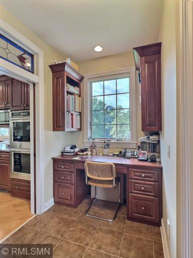 Built in desk area just off the kitchen, but also space for future elevator to lower level if ever needed.