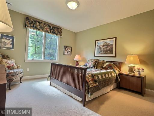 Second bedroom in the lower level, inside the guest suite area, with private bathroom.