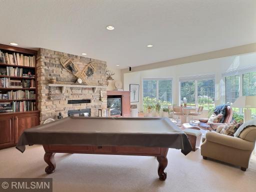Enjoy 9 foot ceilings in the entire lower level, as well as in floor heat. Lower level real wood fireplace to keep things cozy all winter long.