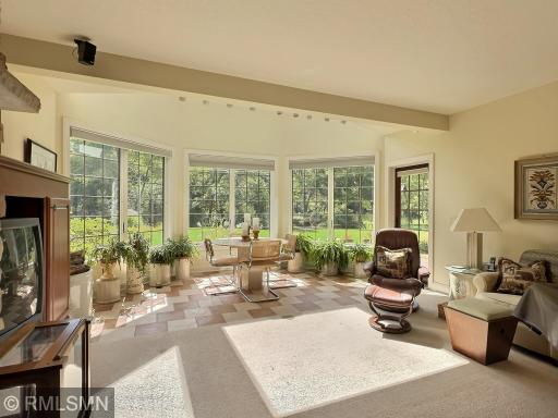 Lower level walk out from the family room to a patio and beautiful flower gardens.