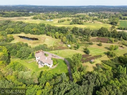 This is a unique opportunity to have a large custom-built home on nearly 32 acres of rolling woods and a small lowland area.