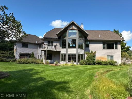 The upper deck features a retractable awning and is constructed with rare ironwood.