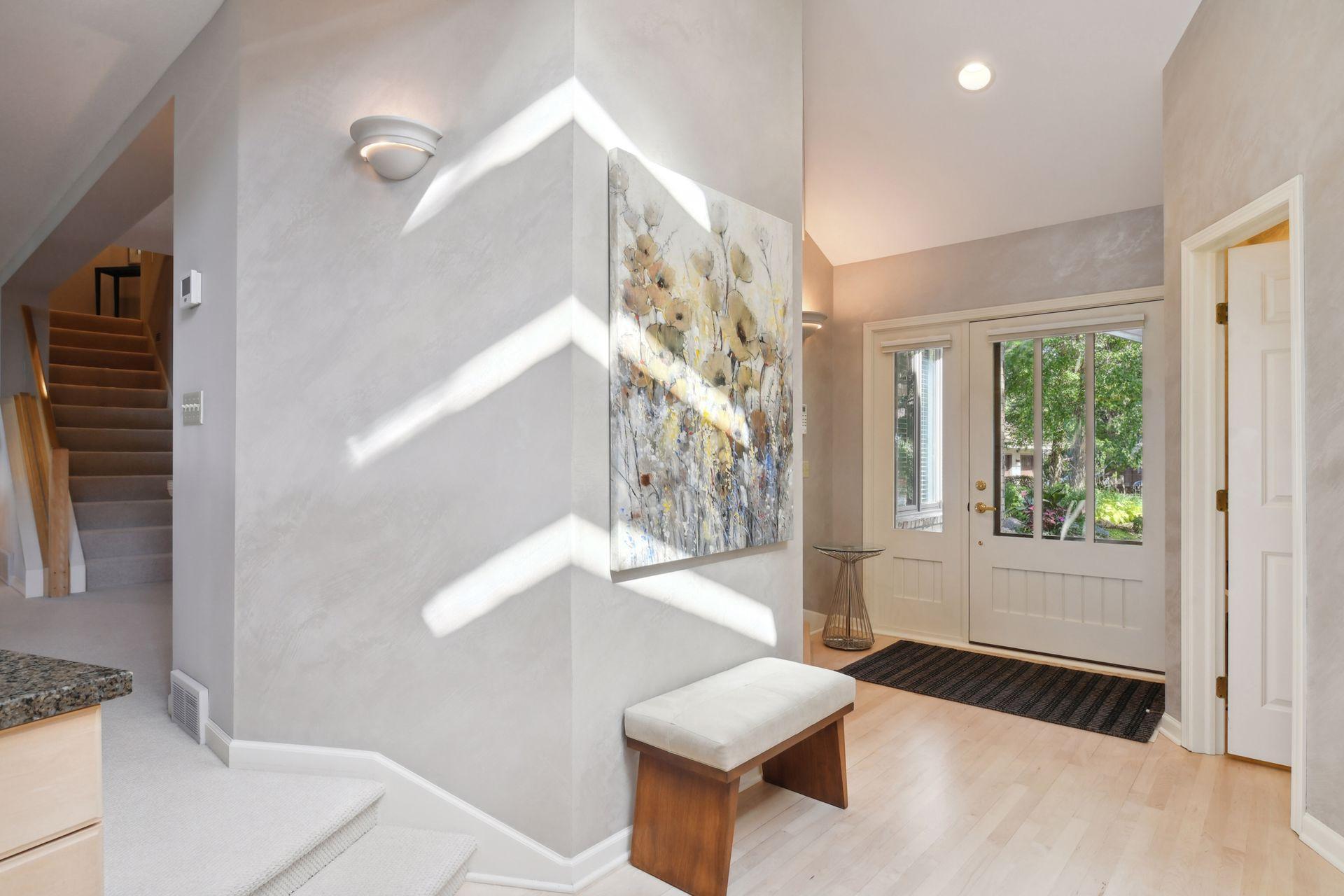 The light and bright foyer with views of the lake from the moment that you enter the home.