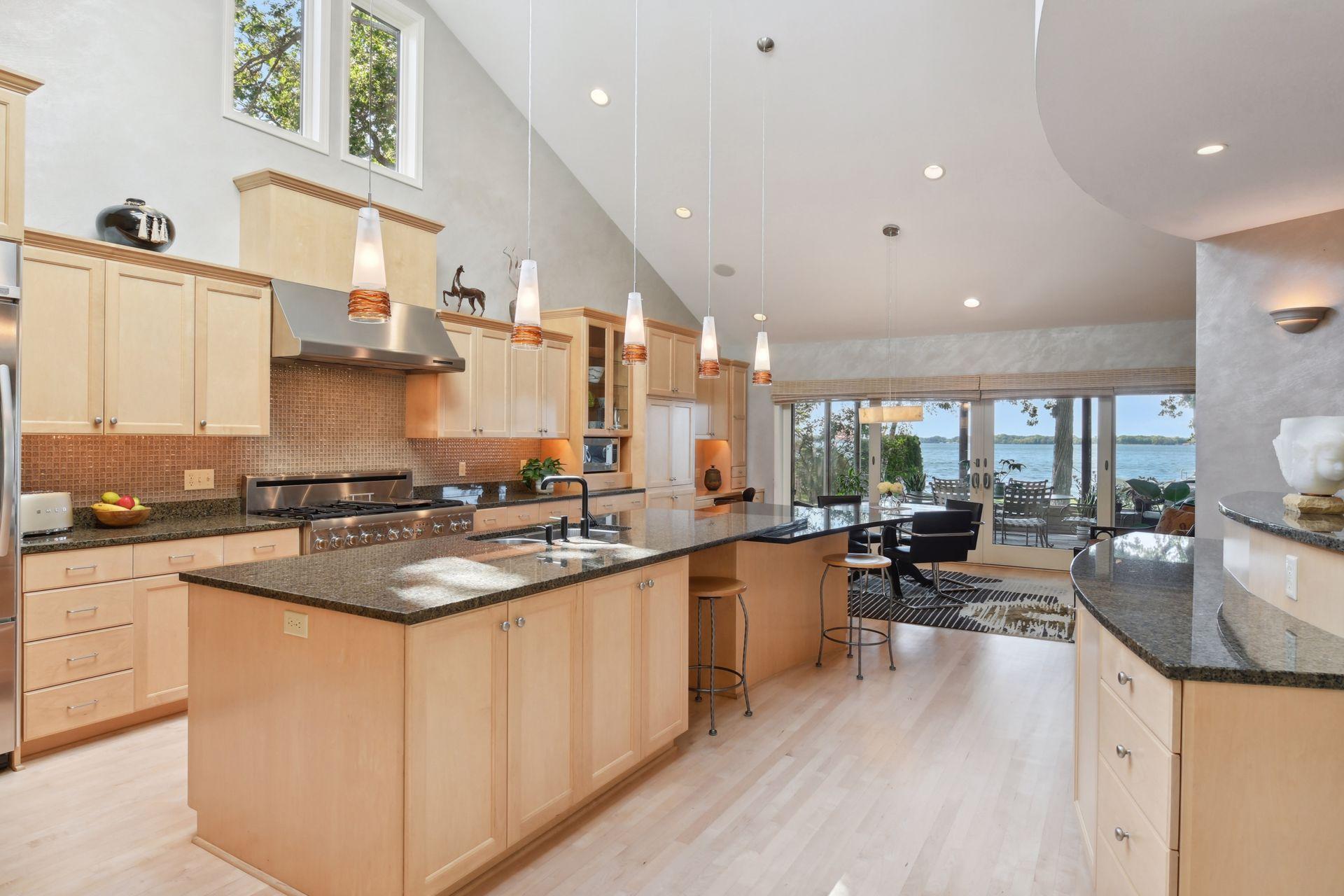 Spacious center island and an informal dining area that opens to the screen porch.