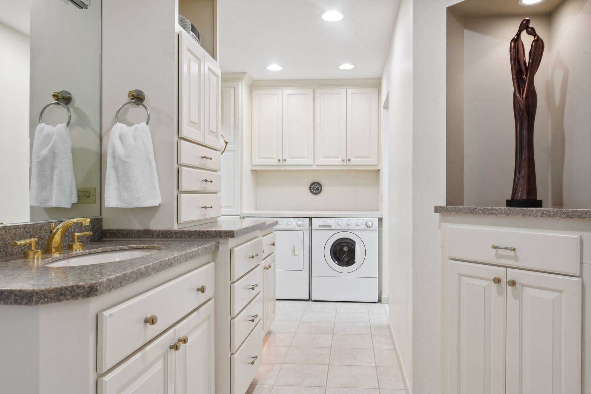 Dual vanities and closets in the primary suite bathroom.