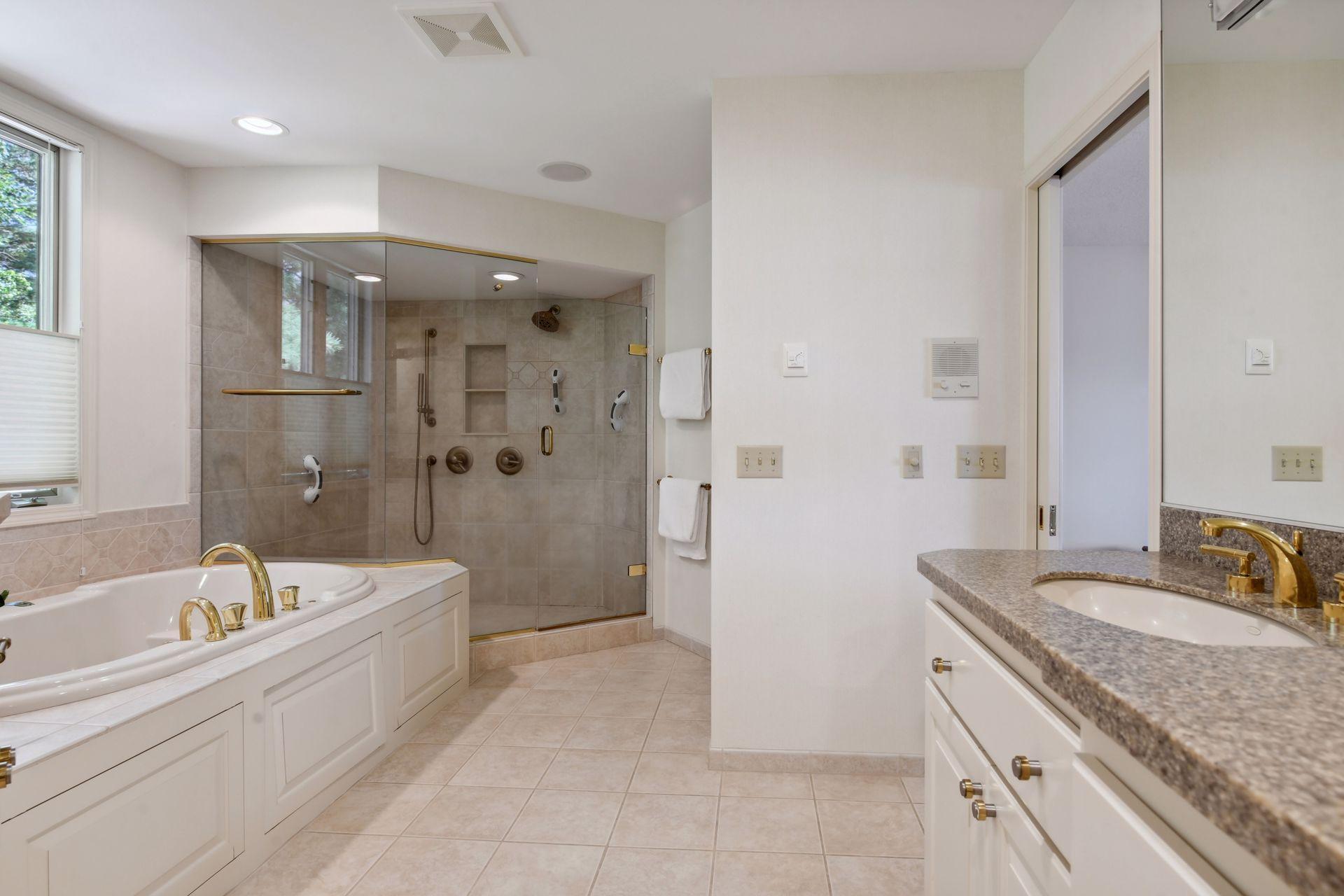 Spacious walk-in shower stall.