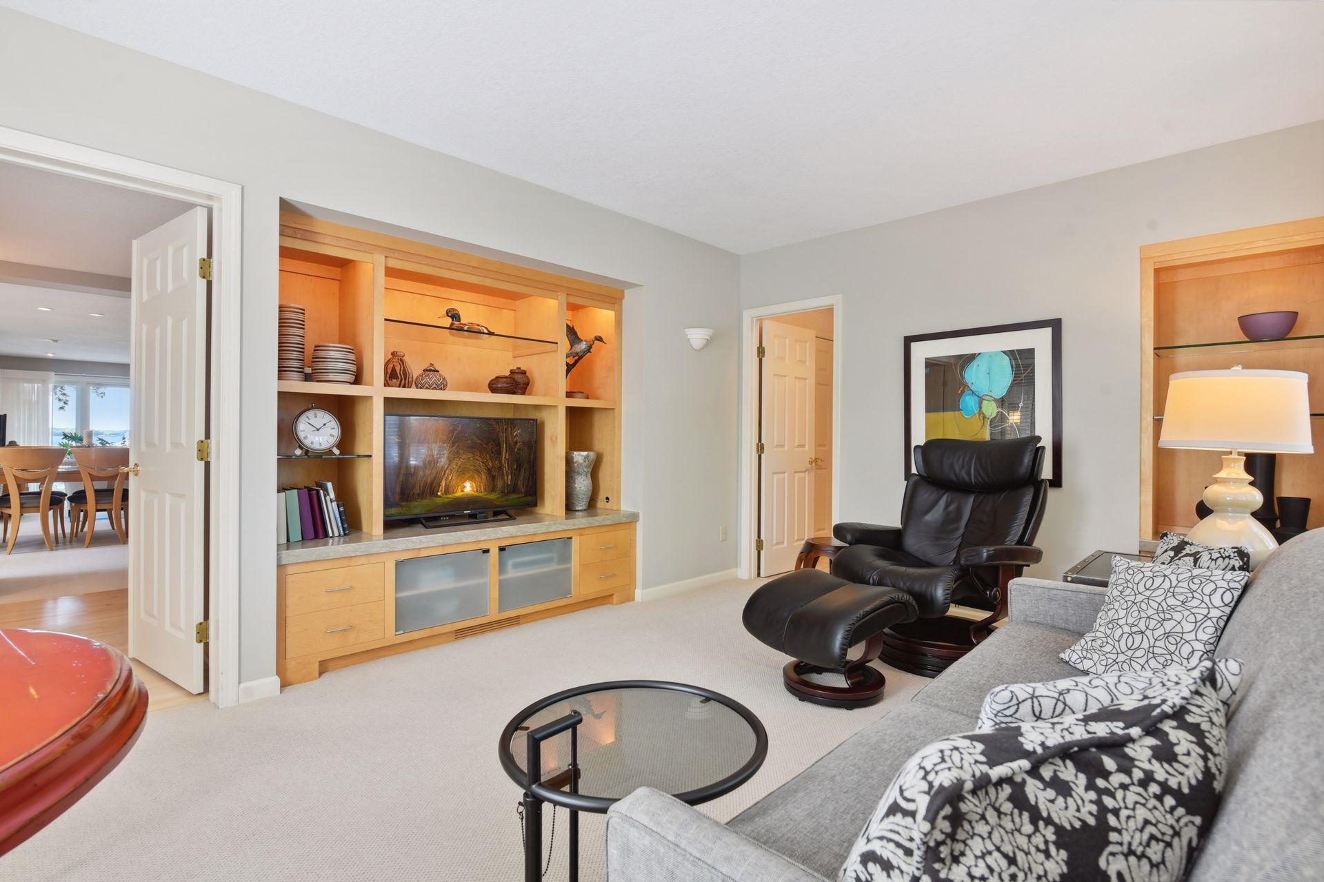 Another view of the mainfloor bedroom/den with wonderful built-in entertainment center.