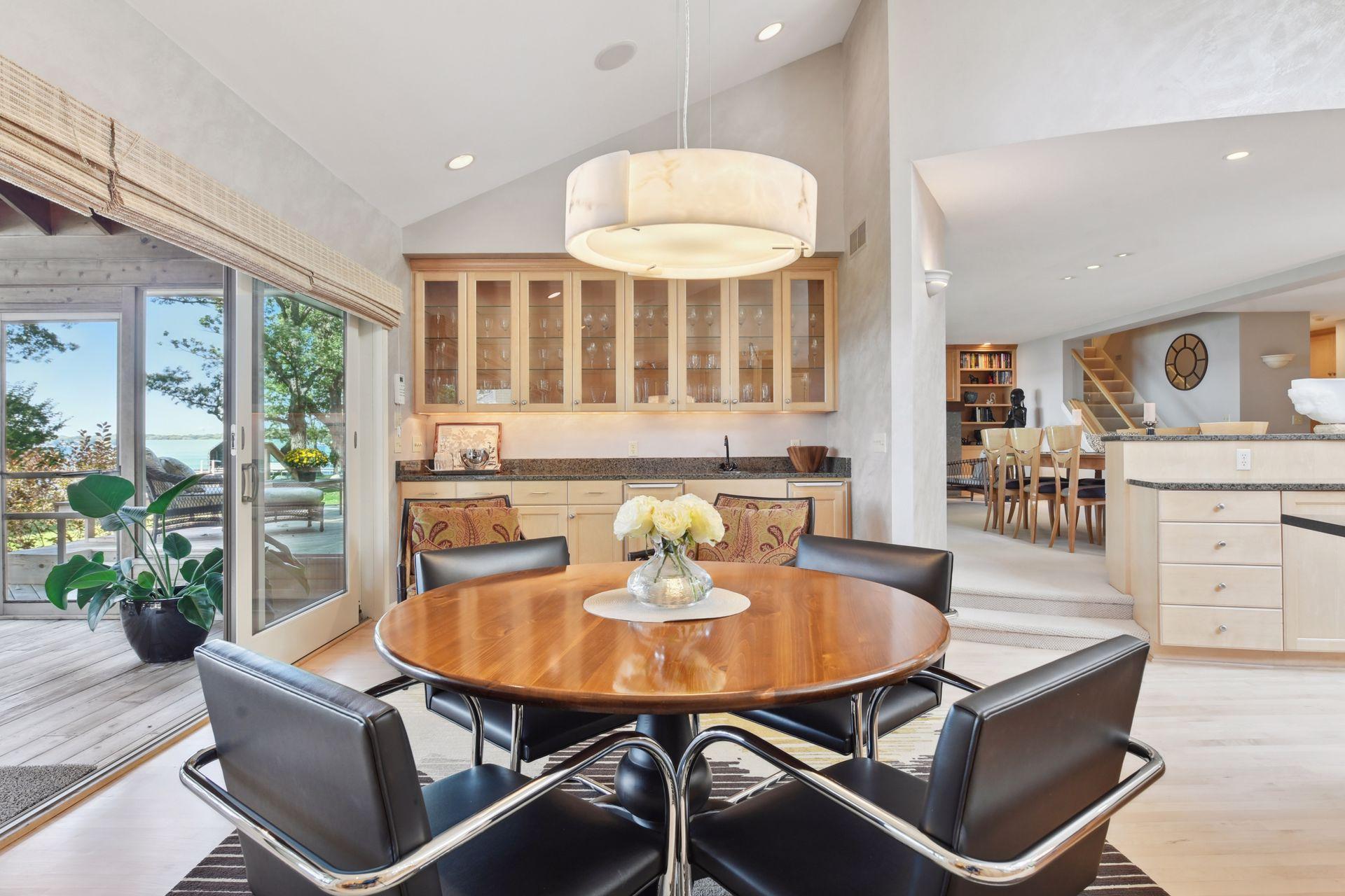 The informal dining area and built-in wet bar space complete with an icemaker and refrigerator.