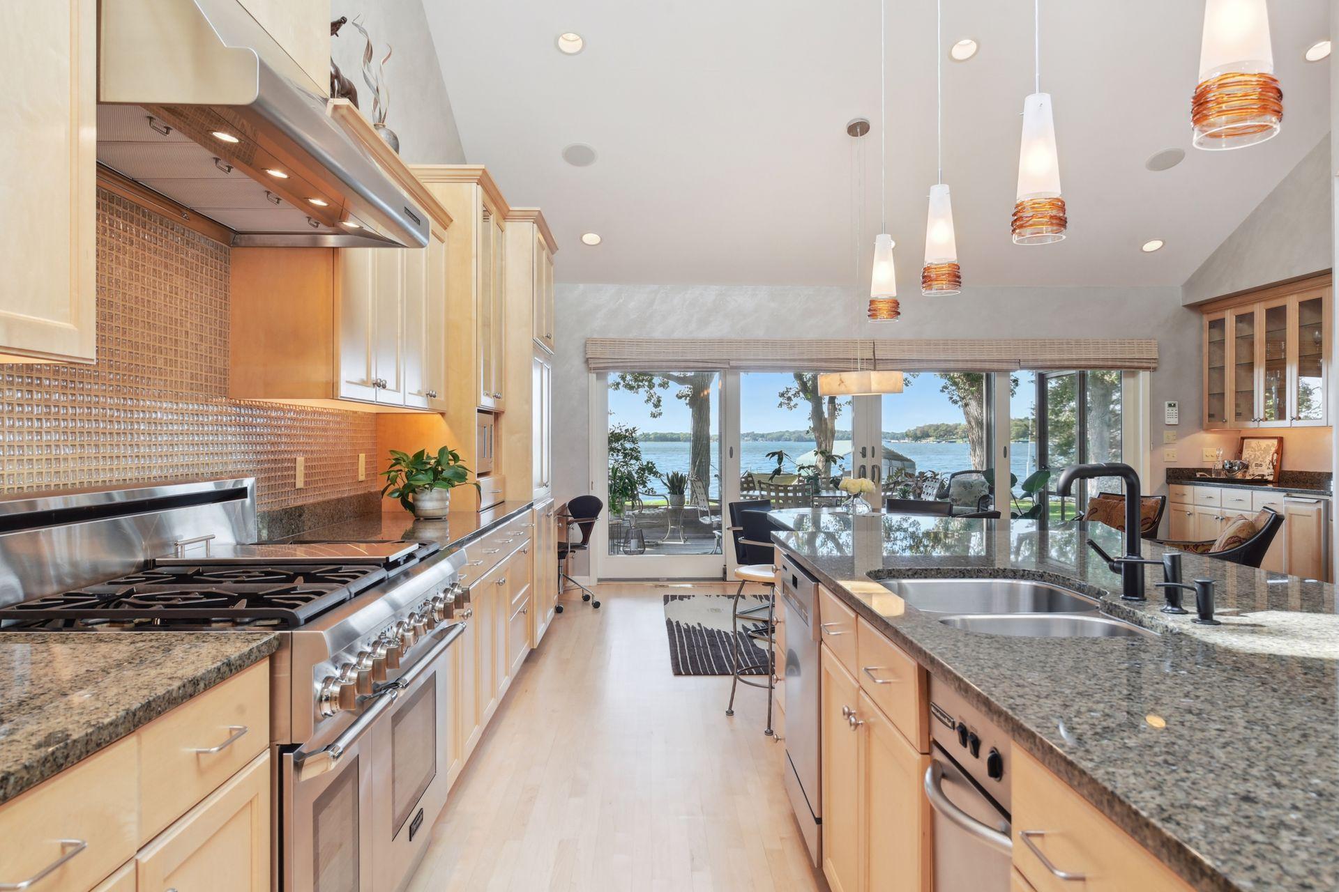 Kitchen complete with a Thermador 6 burner range.