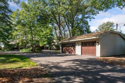 The home is situated on a .62 acre lot with 96ft of west facing lakeshore. There are 2 attached garage stalls and a 3 car detached garage. Both are heated and the detached garage is complete with floor drains and upper level storage.