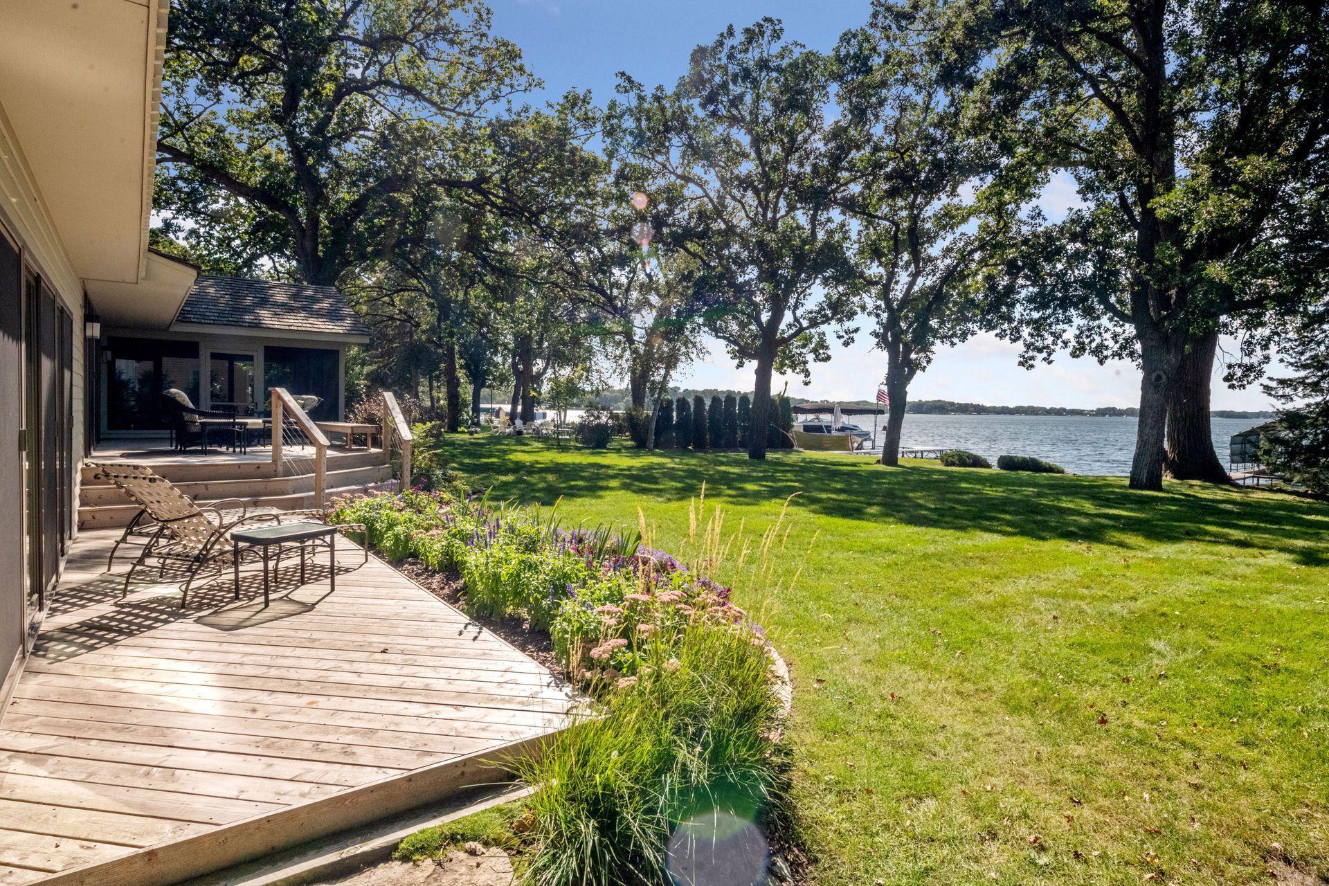 Plenty of space to play to enjoy yard games with this .62 acre lot and 96ft of sandy west facing lakeshore!