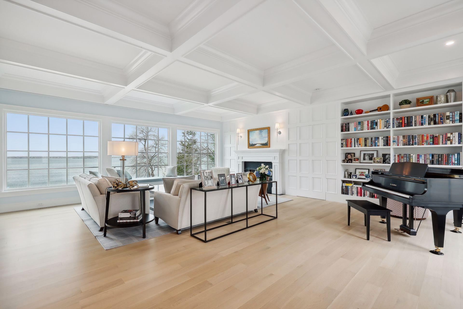 The panel next to the book shelves pushes open to private access to the primary suite.