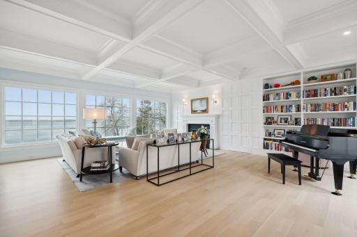 The panel next to the book shelves pushes open to private access to the primary suite.