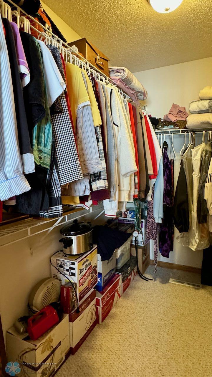 (18) Primary Bedroom Walk In Closet.jpeg