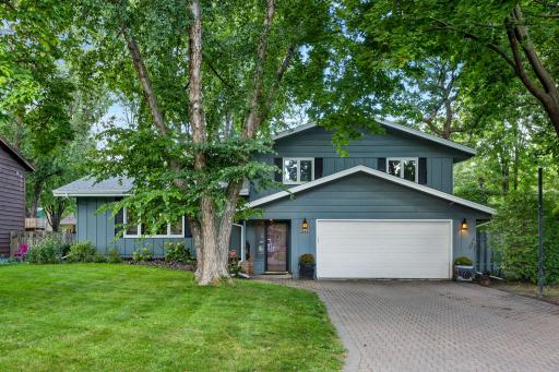 Beautiful curb appeal with this wonderfully maintained home. Newer roof (2017), gutters w/gutter guards/filters, paver driveway, newer garage door & opener, gorgeous landscaping, & more.