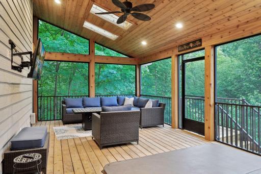 Step into the serene screen porch, where you can soak in the views of the lush wooded yard. This tranquil space is perfect for enjoying the beauty of nature while relaxing in the comfort of your own home.