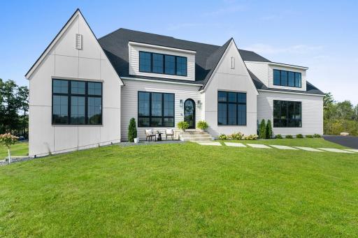 This custom-built luxury home, completed in 2022, sits on an expansive 4.7-acre lot, offering a serene and private retreat.