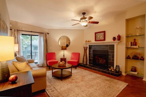 Photo for 5512 Bimini Drive, Minnetonka, MN 55343 - listing #6601990 Upper level living room with a natural gas fireplace and large window with a view of the deck.jpg