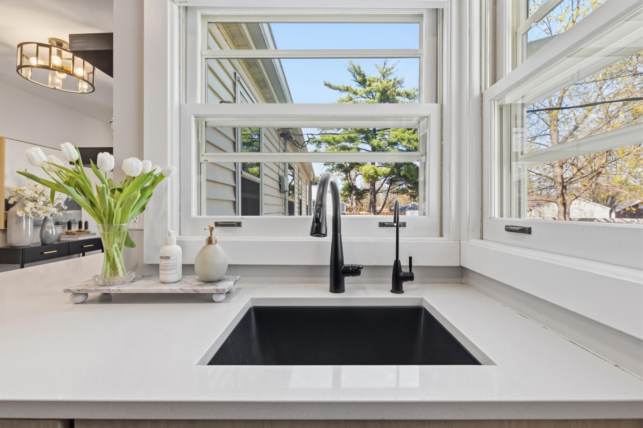 Extra large sink and attractive faucet blend high style and function.