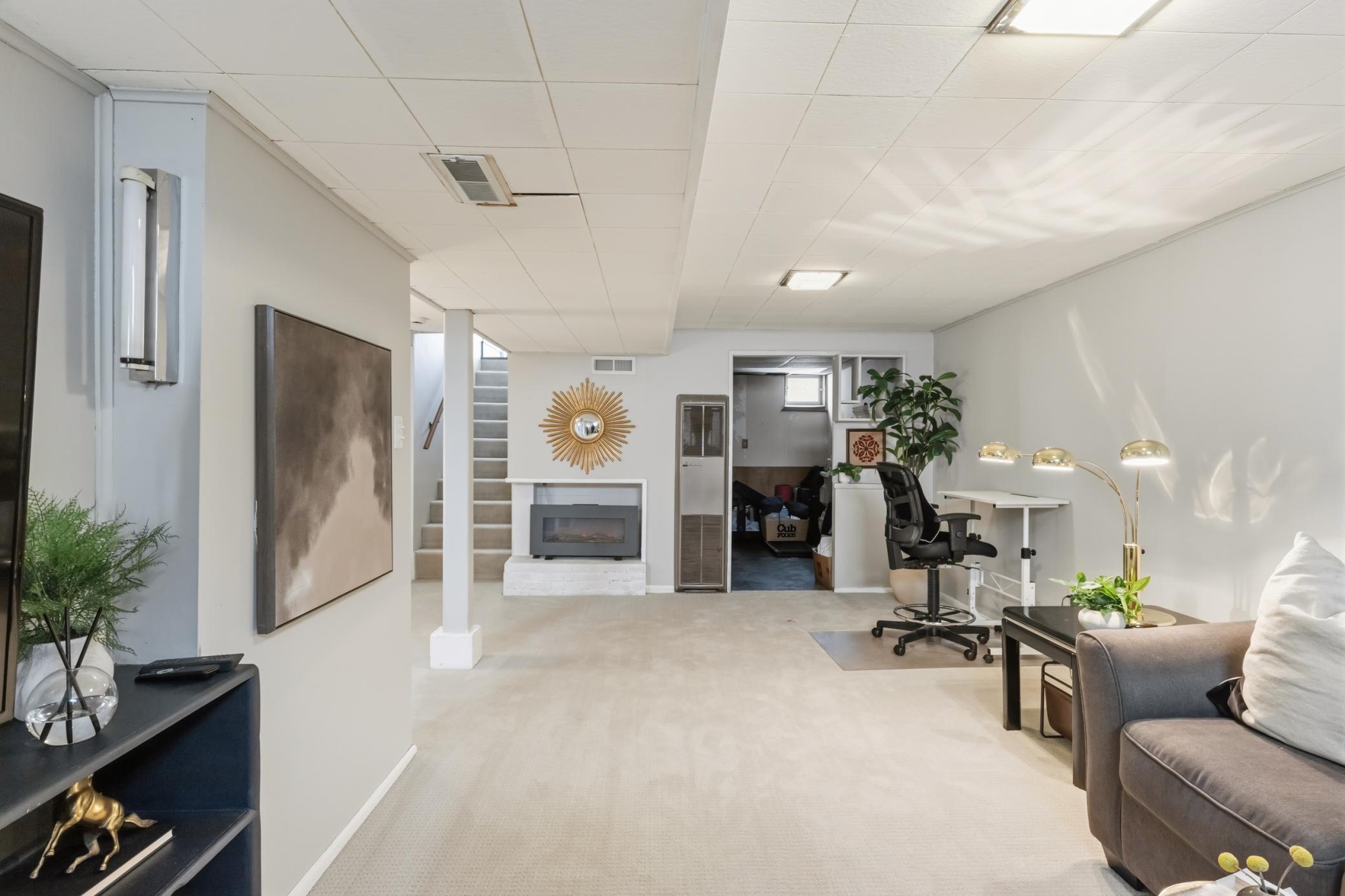 Spacious family room is large enough to function as recreation room, play space, or convenient home office.