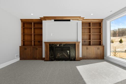 Lower Level Family Room Fireplace and Book Shelves